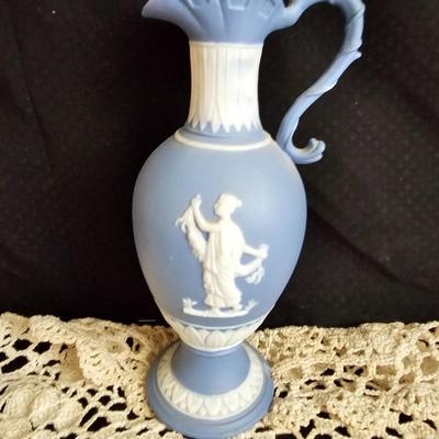 Vintage blue Jasperware vase with large handknitted Doiley