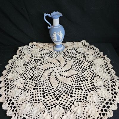 Vintage blue Jasperware vase with large handknitted Doiley
