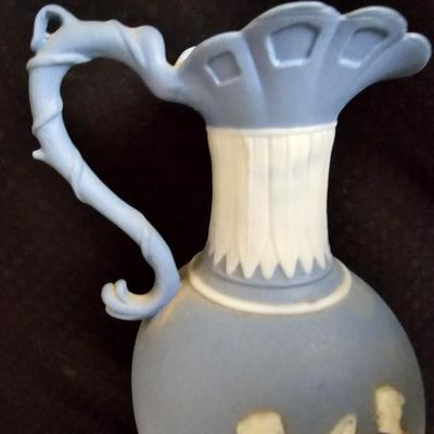 Vintage blue Jasperware vase with large handknitted Doiley