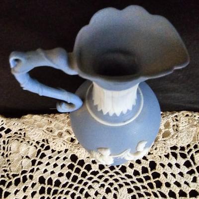 Vintage blue Jasperware vase with large handknitted Doiley