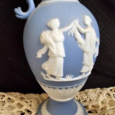 Vintage blue Jasperware vase with large handknitted Doiley