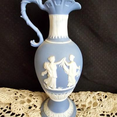 Vintage blue Jasperware vase with large handknitted Doiley