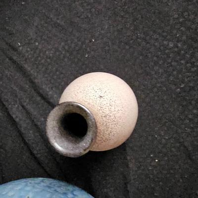 Pottery vase and a smaller tan ceramic vase