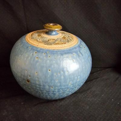 Pottery vase and a smaller tan ceramic vase