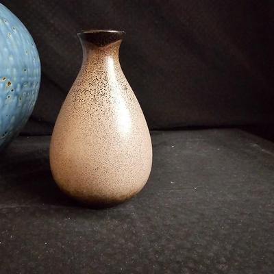 Pottery vase and a smaller tan ceramic vase