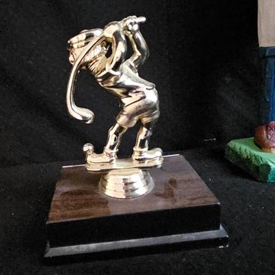 Golfing and skiing figures - tall wooden golfer - golfing trp[hy - and a pewter skier
