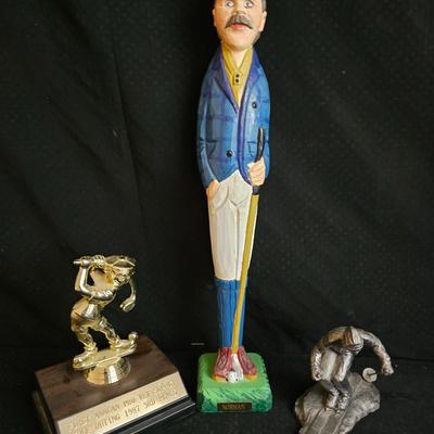 Golfing and skiing figures - tall wooden golfer - golfing trp[hy - and a pewter skier