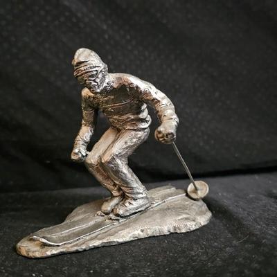 Golfing and skiing figures - tall wooden golfer - golfing trp[hy - and a pewter skier
