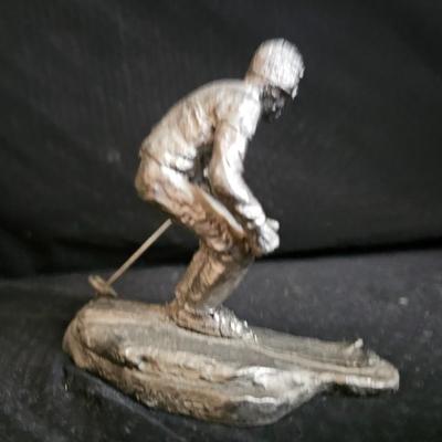 Golfing and skiing figures - tall wooden golfer - golfing trp[hy - and a pewter skier