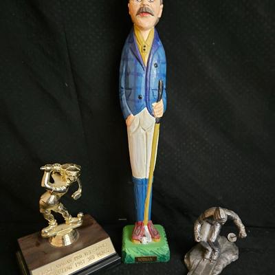 Golfing and skiing figures - tall wooden golfer - golfing trp[hy - and a pewter skier