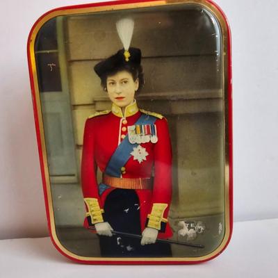 Queen Elizabeth toffee tin - made in England and a vintage lead soldier figure