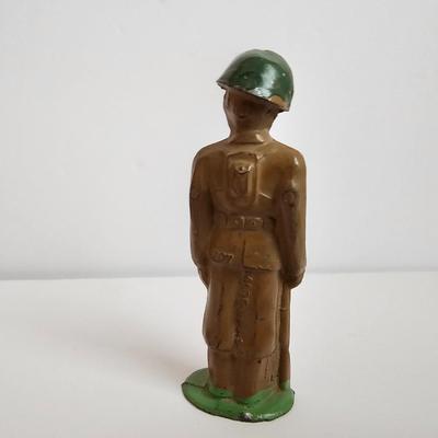 Queen Elizabeth toffee tin - made in England and a vintage lead soldier figure