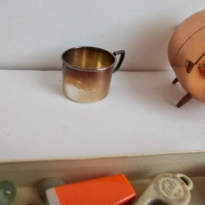 Lots of vintage child trinkets - Star brand roll caps box - old marbles - Brass piggy bank - silverplated child's mug, 1947 Captain...