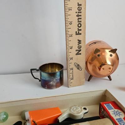 Lots of vintage child trinkets - Star brand roll caps box - old marbles - Brass piggy bank - silverplated child's mug, 1947 Captain...