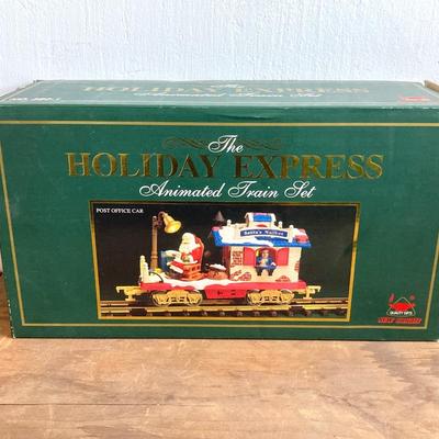 LOT 42: The Holiday Express Animated Train Set Pieces in Original Boxes (Post Office Car, Water Tanker Skating Car, Bakery Car, Log Mill...