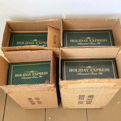 LOT 42: The Holiday Express Animated Train Set Pieces in Original Boxes (Post Office Car, Water Tanker Skating Car, Bakery Car, Log Mill...