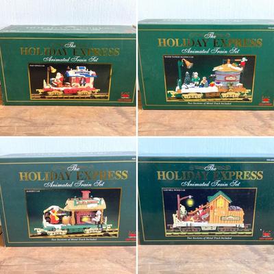 LOT 42: The Holiday Express Animated Train Set Pieces in Original Boxes (Post Office Car, Water Tanker Skating Car, Bakery Car, Log Mill...