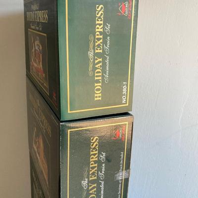 LOT 42: The Holiday Express Animated Train Set Pieces in Original Boxes (Post Office Car, Water Tanker Skating Car, Bakery Car, Log Mill...