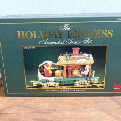 LOT 42: The Holiday Express Animated Train Set Pieces in Original Boxes (Post Office Car, Water Tanker Skating Car, Bakery Car, Log Mill...