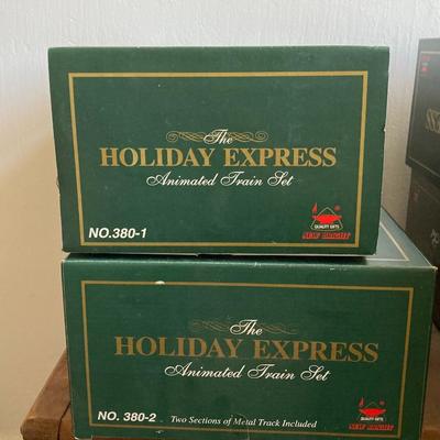 LOT 42: The Holiday Express Animated Train Set Pieces in Original Boxes (Post Office Car, Water Tanker Skating Car, Bakery Car, Log Mill...