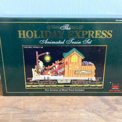 LOT 42: The Holiday Express Animated Train Set Pieces in Original Boxes (Post Office Car, Water Tanker Skating Car, Bakery Car, Log Mill...