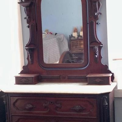 LOT 60: Victorian Hand Carved Wood Marble Topped Dresser with Tilting Mirror