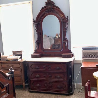 LOT 60: Victorian Hand Carved Wood Marble Topped Dresser with Tilting Mirror