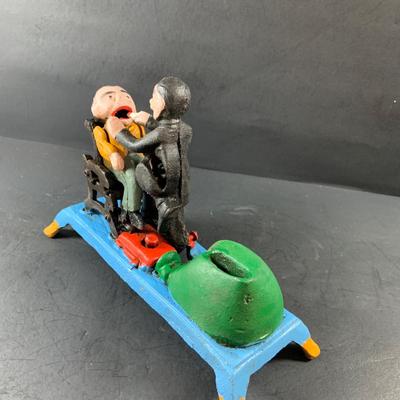 LOT 78: Vintage Cast Iron Dentist and Patient Mechanical Bank