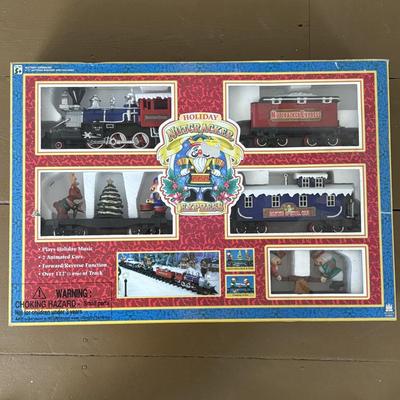 LOT 85: North Pole Toy Shop Animated Christmas Train, Holiday Nutcracker Train Set (unopened) & 3-Wooden Nutcrackers