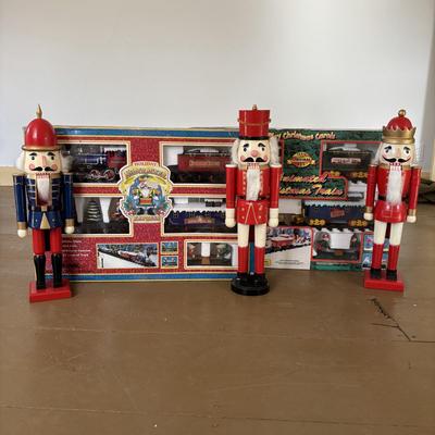 LOT 85: North Pole Toy Shop Animated Christmas Train, Holiday Nutcracker Train Set (unopened) & 3-Wooden Nutcrackers