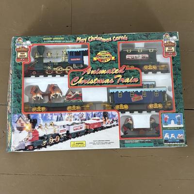 LOT 85: North Pole Toy Shop Animated Christmas Train, Holiday Nutcracker Train Set (unopened) & 3-Wooden Nutcrackers