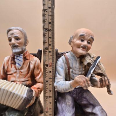 LOT 163: Norleans Japan Elderly Couple Reading Books in Rocking Chairs Bookends, & Instrument Playing Figures