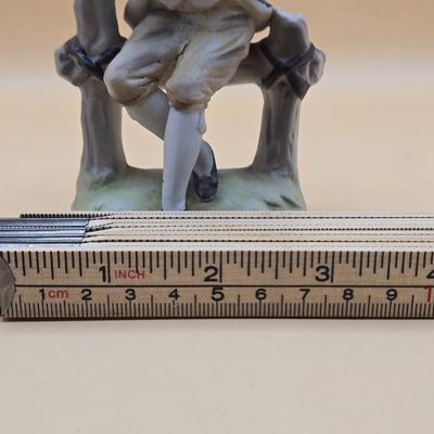 LOT 163: Norleans Japan Elderly Couple Reading Books in Rocking Chairs Bookends, & Instrument Playing Figures