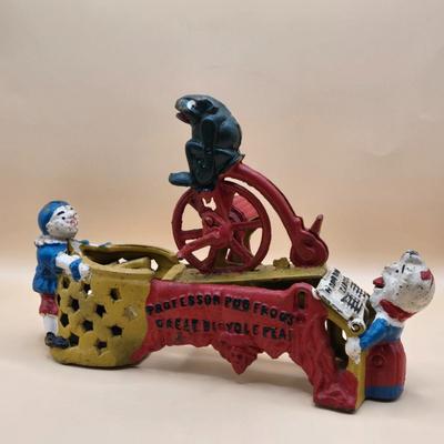 LOT 166: " Professor Pug Frog's Great Bicycle Feat" Cast Iron Mechanical Bank