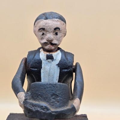 LOT 167: Magician Cast Iron Mechanical Bank