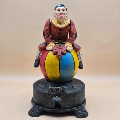 LOT 170: " Spinning Acrobat Clown on Globe" Cast Iron Mechanical Bank