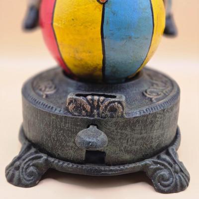 LOT 170: " Spinning Acrobat Clown on Globe" Cast Iron Mechanical Bank