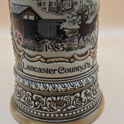 LOT 175: 1984 Olympic Beer Stein, Lancaster Beer Stein, and Collection of Avon Beer Steins