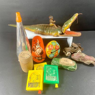 LOT 197: Vintage Toys Including Noise Makers Pin-Bo Sport-o-Rama Real Action Baseball Games, Toy Cars, J Chein Tin Wind-Up Alligator Toy...