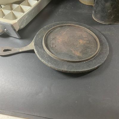 LOT 198: Primitive Kitchen Collection Including a Cast Iron Flat Griddle, Figidare Metal Icecube Tray, Tin Pudding Mold and Much More