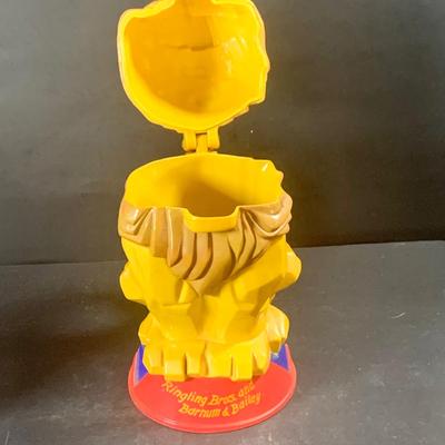 LOT 199: Circus Collection Including a Vintage Rolly Polly Clown, Bear on a Ball, Tin Toy Horse, Ringling Bros Lion Mug, Milk Glass Clown...