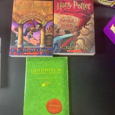 LOT 201: Harry Potter Collection Including Books, Enesco Plaques, Mattel Hedwig Toy, and Story Teller Figurines