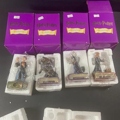 LOT 201: Harry Potter Collection Including Books, Enesco Plaques, Mattel Hedwig Toy, and Story Teller Figurines