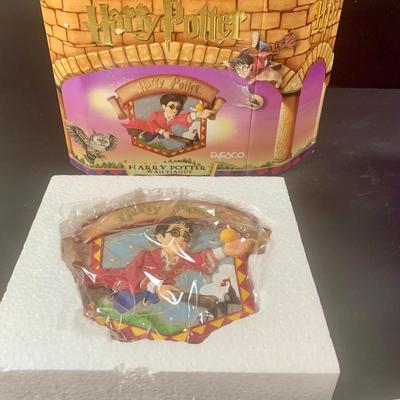 LOT 201: Harry Potter Collection Including Books, Enesco Plaques, Mattel Hedwig Toy, and Story Teller Figurines