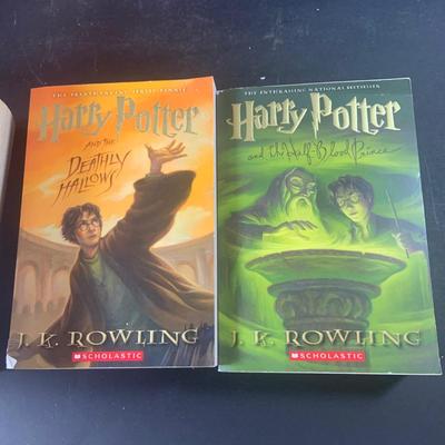 LOT 203: Colletion of Harry Potter Books and Enesco Plaques.