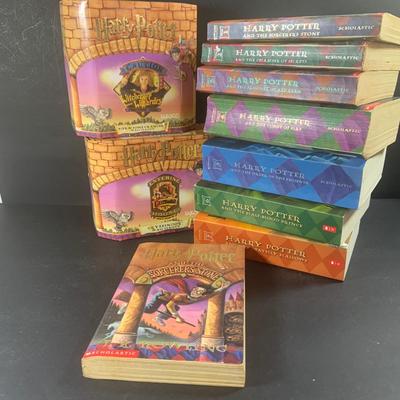 LOT 203: Colletion of Harry Potter Books and Enesco Plaques.