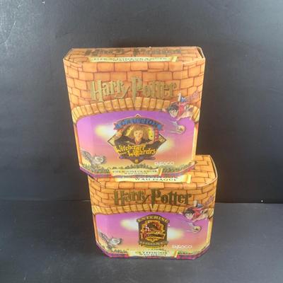 LOT 203: Colletion of Harry Potter Books and Enesco Plaques.