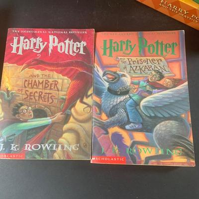 LOT 203: Colletion of Harry Potter Books and Enesco Plaques.
