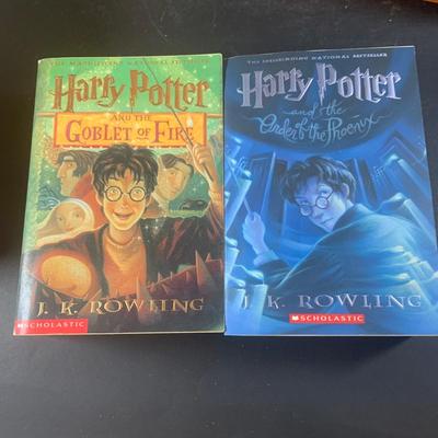 LOT 203: Colletion of Harry Potter Books and Enesco Plaques.