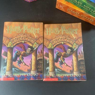 LOT 203: Colletion of Harry Potter Books and Enesco Plaques.